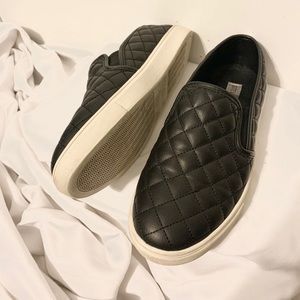 Black Steve Madden quilted slip-ons